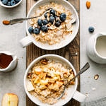 top down view of 2 healthy bowls of Instant Pot steel cut oats in a bowl with flavor topping.
