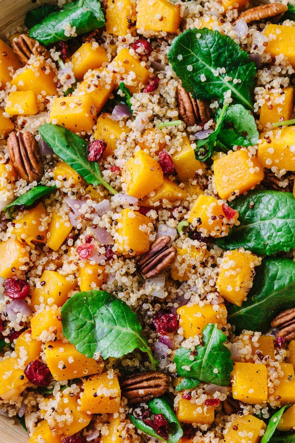 a close up top view of butternut squash and quinoa salad