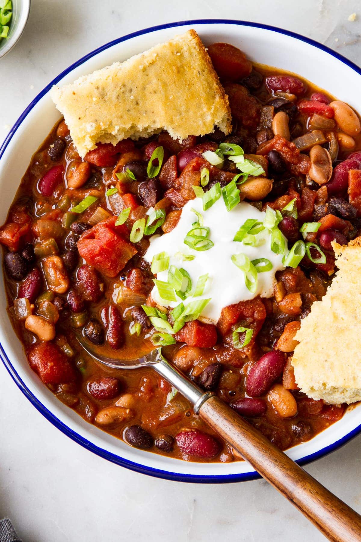 top down view of a bowl full of quick and easy three bean chili.